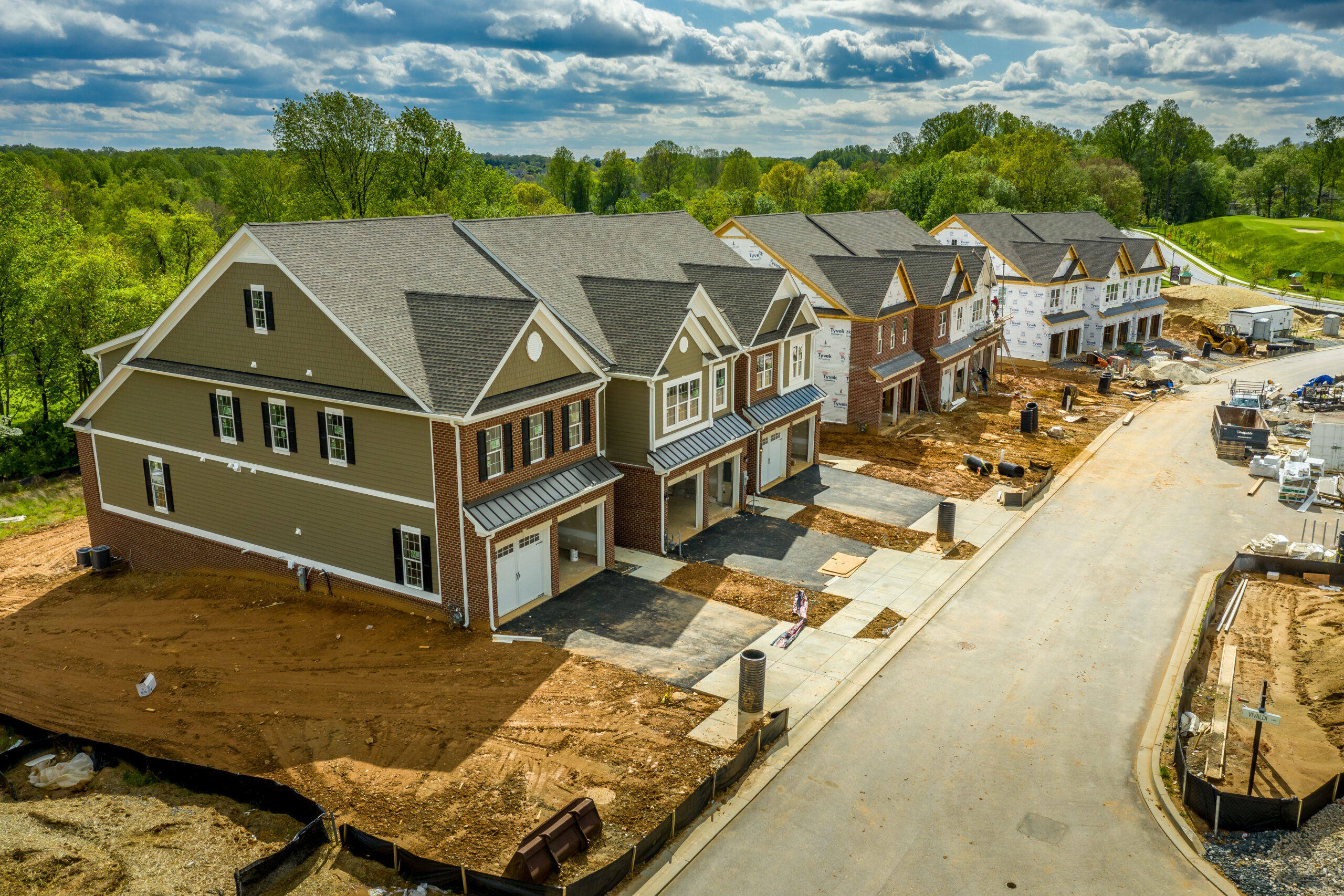 Elevated view of almost finished luxury townhouses with two sing